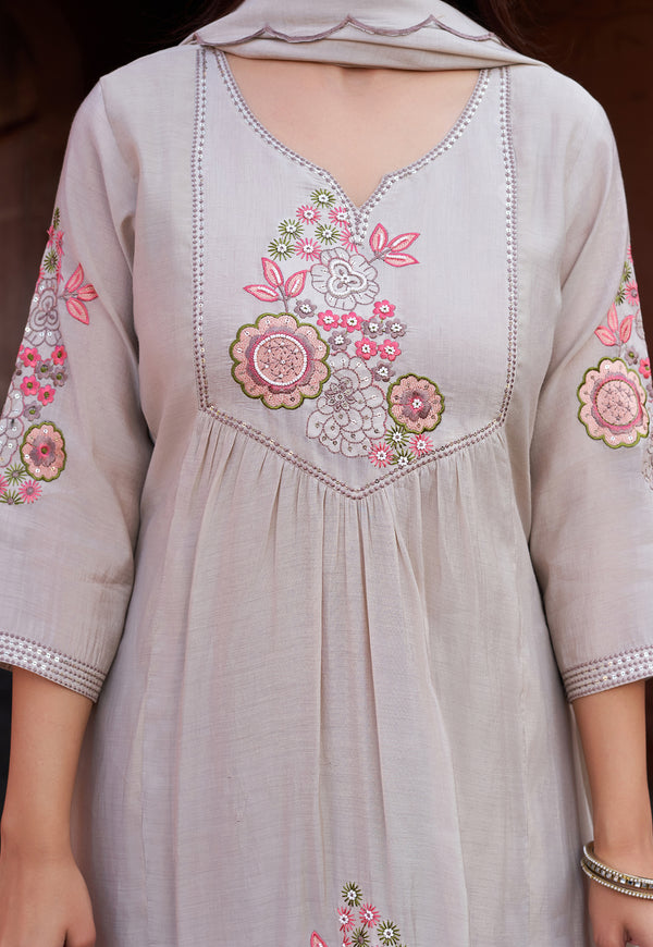 Light gray dress with floral embroidery on a plain background